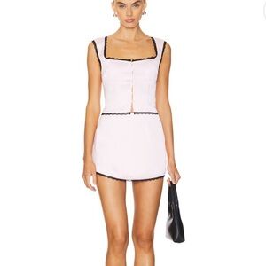 Pink skirt set with black lace trim